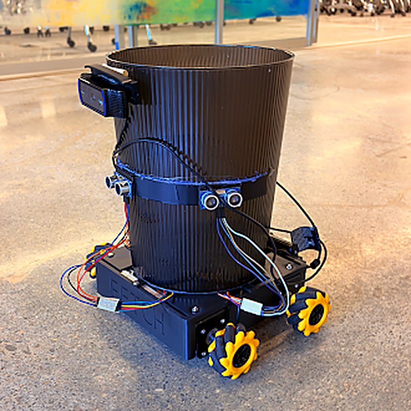 Fetch mecanum robot, side angle showing the yellow mecanum wheels and wiring