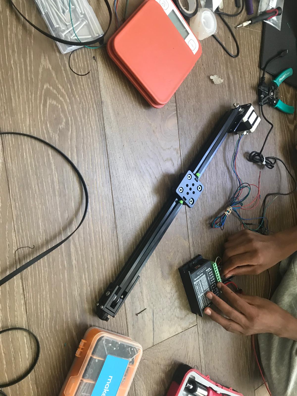 Hope's rail assembly on the workbench, wired to the microstepping driver mid-build