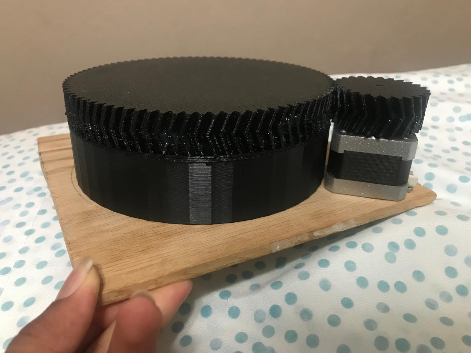 MARS-61 herringbone gear reduction prototype next to its NEMA17 drive motor